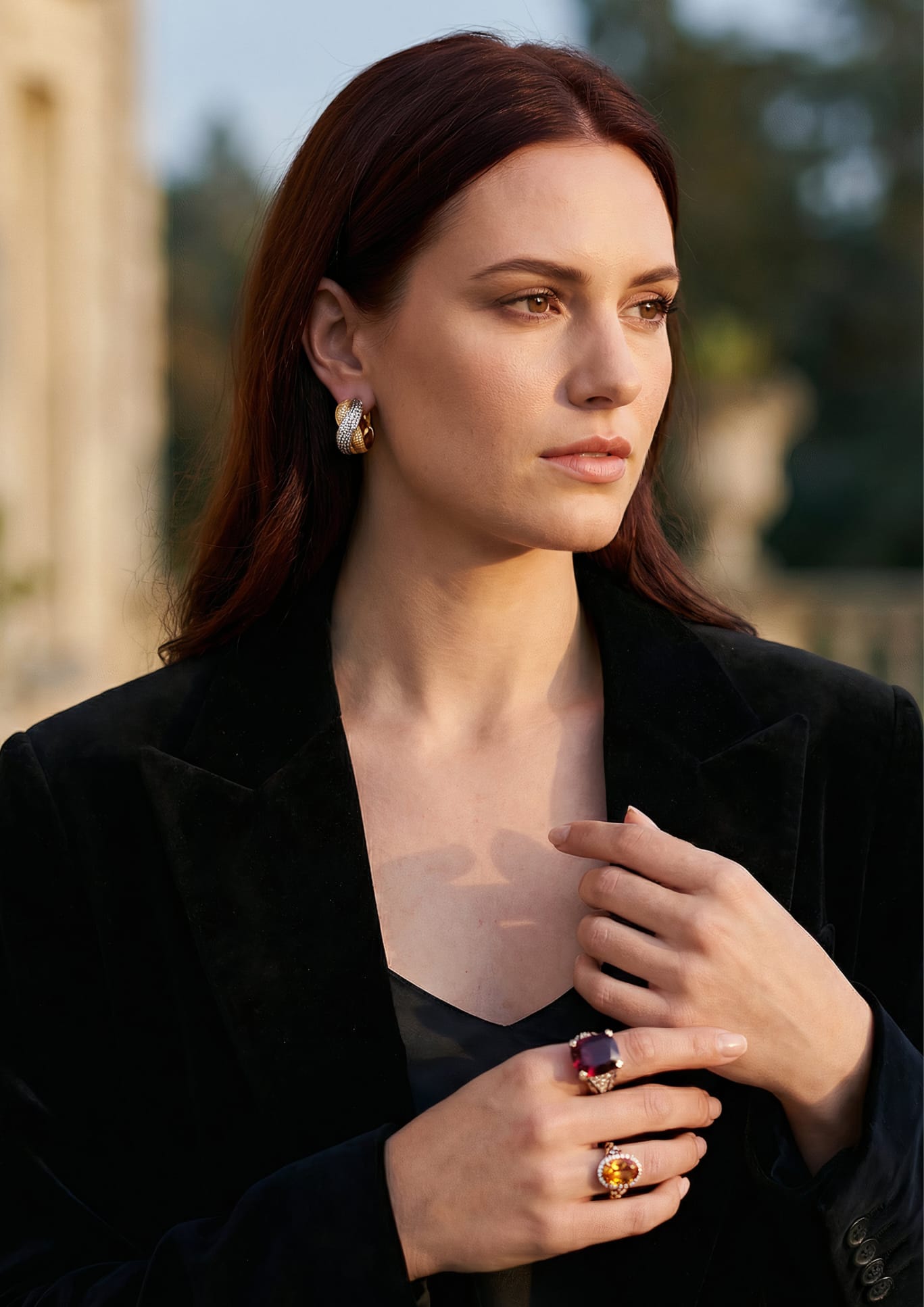 Redhead model wearing warm-toned jewelry